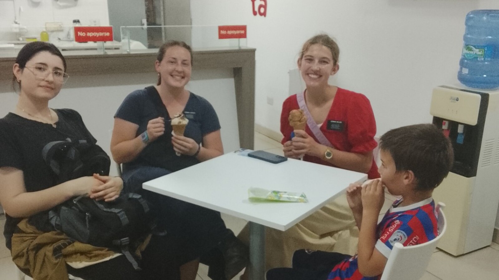 Sam eating ice cream with missionaries from his local church in Paraguay.